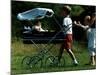 Princess Beatrice is being pushed in pram by Prince william and Harry-null-Mounted Photographic Print