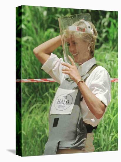 Princess Diana Adjusts Her Face Protector During Her Visit to Mine Fields in Haumbo Angola-null-Stretched Canvas