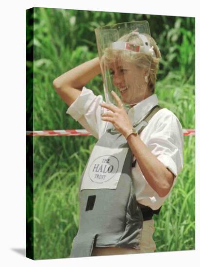 Princess Diana Adjusts Her Face Protector During Her Visit to Mine Fields in Haumbo Angola-null-Stretched Canvas