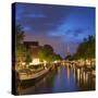 Prinsengracht canal and Westerkerk at dusk, Amsterdam, Netherlands-Ian Trower-Stretched Canvas