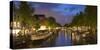 Prinsengracht canal and Westerkerk at dusk, Amsterdam, Netherlands-Ian Trower-Stretched Canvas