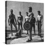 Prisoners at San Quentin Weightlifting in Prison Yard During Recreation Period-Charles E^ Steinheimer-Stretched Canvas