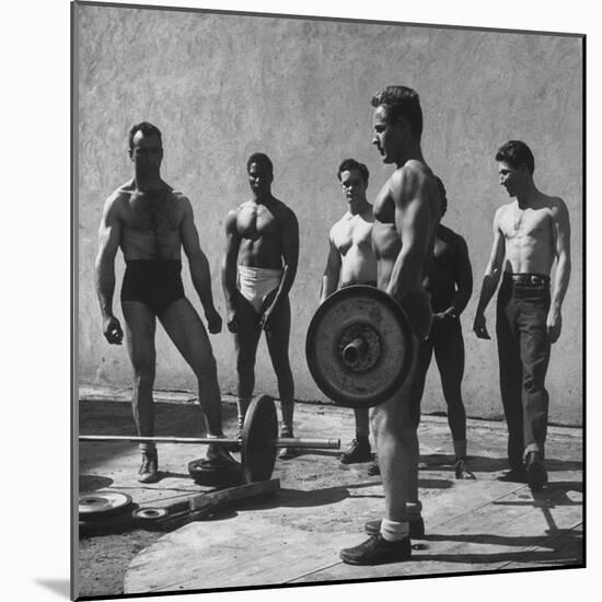 Prisoners at San Quentin Weightlifting in Prison Yard During Recreation Period-Charles E^ Steinheimer-Mounted Photographic Print