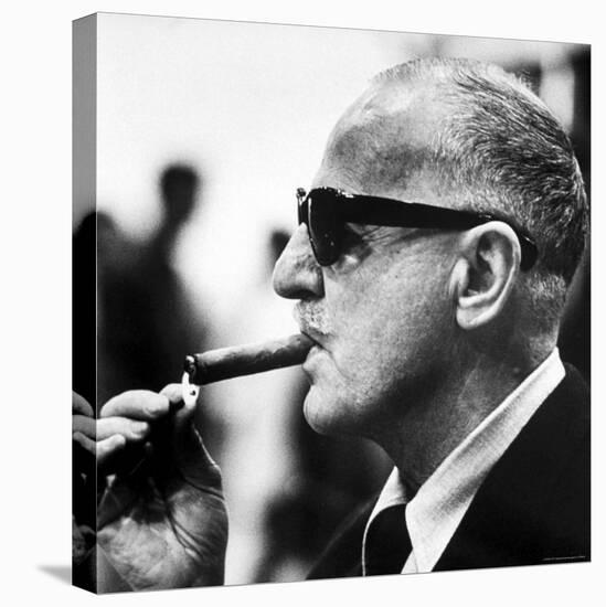 Producer Darryl F. Zanuck Lighting Cigar on the Set of Film "Rapture"-Carlo Bavagnoli-Stretched Canvas