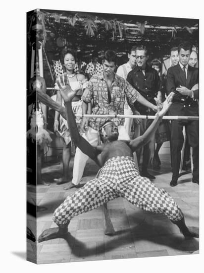 Professional Limbo Dancer Performing with Ease-Ralph Crane-Stretched Canvas