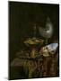 Pronk Still Life with Holbein Bowl, Nautilus Cup, Glass Goblet and Fruit Dish, 1678-Willem Kalf-Mounted Giclee Print