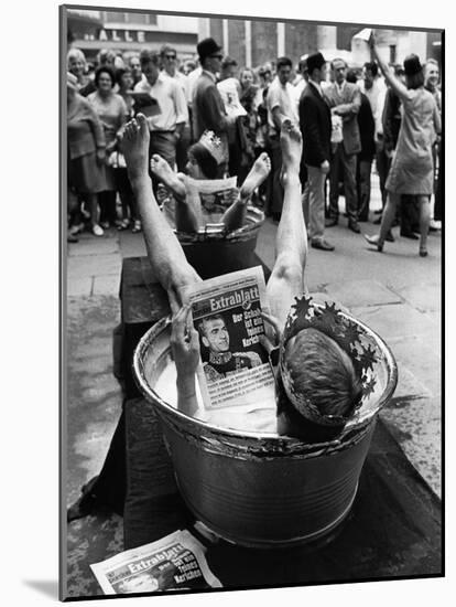 Protesters Sit in Bath Tubs and Read the Satirical Newspaper "Pardon"-null-Mounted Photographic Print