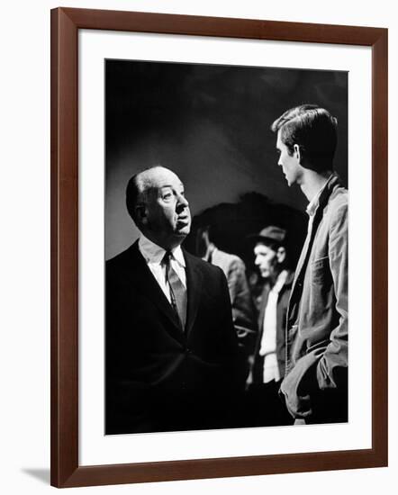 PSYCHO, 1960 directed by ALFRED HITCHCOCK On the set, Alfred Hitchcock and Anthony Perkins (b/w pho-null-Framed Photo