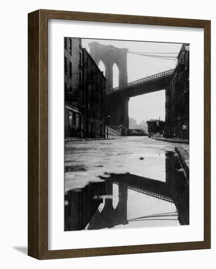 Puddle Reflecting Brooklyn Bridge-Bettmann-Framed Photographic Print