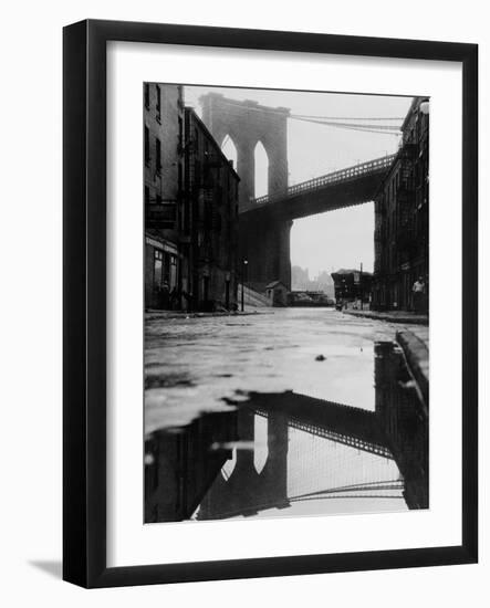 Puddle Reflecting Brooklyn Bridge-Bettmann-Framed Photographic Print