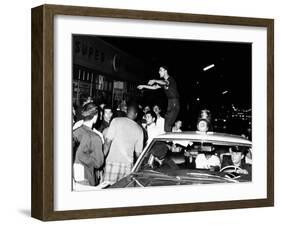 Puerto Rican Youth Urges the Crowd to Go Home and Aid in Dispersing Neighborhood Groups-null-Framed Photo