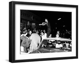 Puerto Rican Youth Urges the Crowd to Go Home and Aid in Dispersing Neighborhood Groups-null-Framed Photo