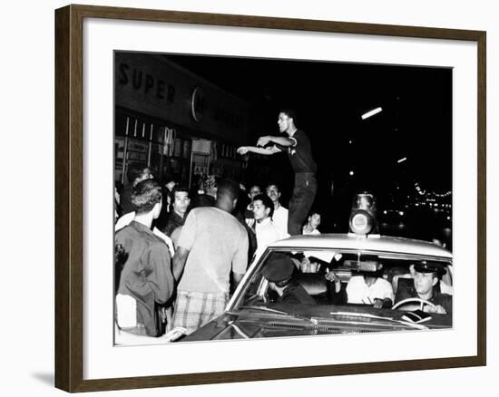 Puerto Rican Youth Urges the Crowd to Go Home and Aid in Dispersing Neighborhood Groups-null-Framed Photo