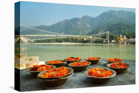 Puja Flowers Offering for the Ganges River in Rishikesh, India-mazzzur-Stretched Canvas