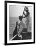 Pulling Quickly, the Beaten Fish Is Taken Aboard the Boat by Gloved Crew Member-null-Framed Photographic Print
