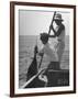 Pulling Quickly, the Beaten Fish Is Taken Aboard the Boat by Gloved Crew Member-null-Framed Photographic Print