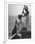 Pulling Quickly, the Beaten Fish Is Taken Aboard the Boat by Gloved Crew Member-null-Framed Photographic Print