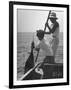 Pulling Quickly, the Beaten Fish Is Taken Aboard the Boat by Gloved Crew Member-null-Framed Photographic Print