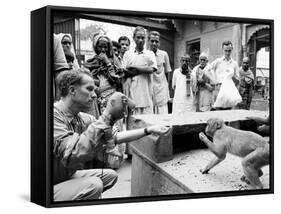 Puppeteer Bil Baird playing with a monkey, March 1962.-James Burke-Framed Stretched Canvas