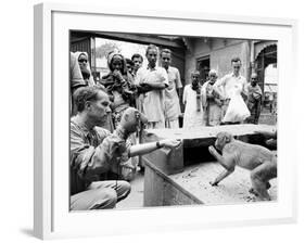 Puppeteer Bil Baird playing with a monkey, March 1962.-James Burke-Framed Premium Photographic Print