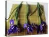 Purple Irises on a Bamboo Mat-Colin Anderson-Stretched Canvas