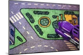 Purple Toy Car on Street Mat-null-Mounted Photo