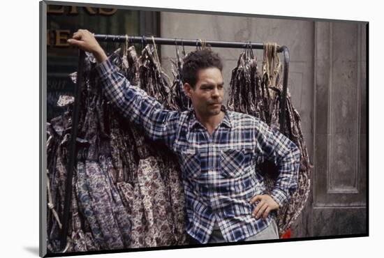 Push Boy as He Leans Against a Racks of Dresses in the Garment District, New York, New York, 1960-Walter Sanders-Mounted Photographic Print