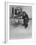 Puzzled Orangutan Standing Next to TV Set Playing the Image of President Richard Nixon-Yale Joel-Framed Photographic Print