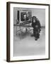 Puzzled Orangutan Standing Next to TV Set Playing the Image of President Richard Nixon-Yale Joel-Framed Photographic Print