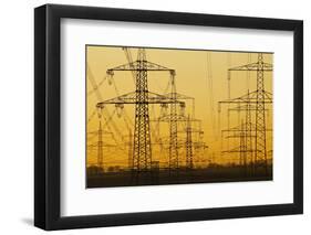 Pylons and power lines in morning light, Germany, Europe-Hans-Peter Merten-Framed Photographic Print