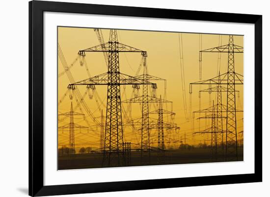 Pylons and power lines in morning light, Germany, Europe-Hans-Peter Merten-Framed Photographic Print