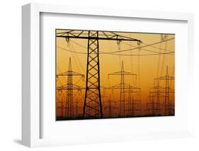 Pylons and power lines in morning light, Germany, Europe-Hans-Peter Merten-Framed Photographic Print