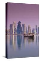 Qatar, Doha, Dhows on Doha Bay with West Bay Skyscrapers, Dawn-Walter Bibikow-Stretched Canvas