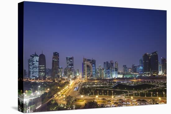 Qatar, Doha, Doha Bay, West Bay Skyscrapers, Elevated View, Dusk-Walter Bibikow-Stretched Canvas