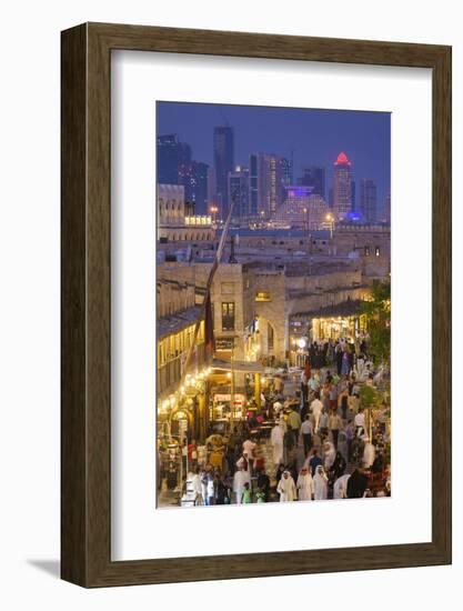 Qatar, Doha, Souq Waqif, redeveloped bazaar area, elevated view with West Bay skyscrapers from one -Walter Bibikw-Framed Photographic Print