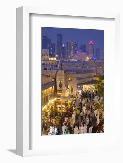 Qatar, Doha, Souq Waqif, redeveloped bazaar area, elevated view with West Bay skyscrapers from one -Walter Bibikw-Framed Photographic Print