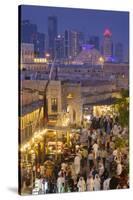 Qatar, Doha, Souq Waqif, redeveloped bazaar area, elevated view with West Bay skyscrapers from one -Walter Bibikw-Stretched Canvas