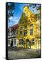 Quaint Yellow House In Old Town Lubeck-George Oze-Framed Stretched Canvas