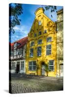 Quaint Yellow House In Old Town Lubeck-George Oze-Stretched Canvas