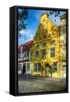 Quaint Yellow House In Old Town Lubeck-George Oze-Framed Stretched Canvas