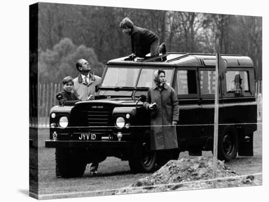 Queen Elizabeth II Looks on as Prince Edward Plays on the Roof of Their Land Rover-null-Stretched Canvas
