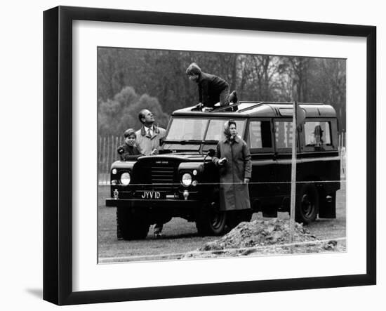 Queen Elizabeth II Looks on as Prince Edward Plays on the Roof of Their Land Rover-null-Framed Photographic Print