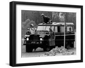 Queen Elizabeth II Looks on as Prince Edward Plays on the Roof of Their Land Rover-null-Framed Photographic Print