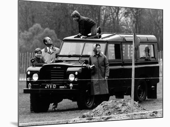 Queen Elizabeth II Looks on as Prince Edward Plays on the Roof of Their Land Rover-null-Mounted Photographic Print