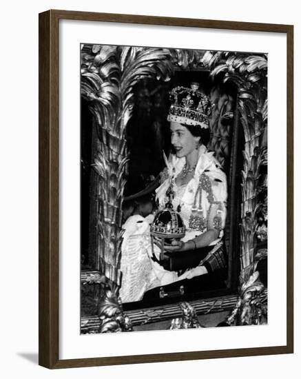 Queen Elizabeth II Riding Along in the Coronation Coach Wearing Crown and Carrying Orb-null-Framed Photographic Print