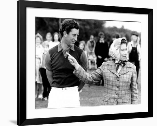 Queen Elizabeth II Shows Prince Charles Sign at a Polo Match at Windsor Great Park Points Finger-null-Framed Photographic Print