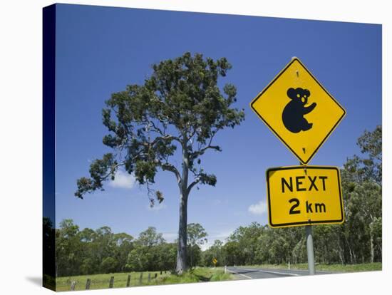 Queensland, Fraser Coast, Maryborough, Koala Crossing Sign on the Bruce Highway, Australia-Walter Bibikow-Stretched Canvas