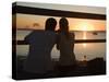 Queensland, Fraser Island, A Couple with Video Camera in Hand Watch Sunset from a Pier, Australia-Andrew Watson-Stretched Canvas