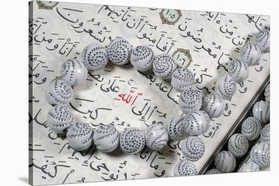 Quran and Tasbih (prayer beads), with Allah monogram in red, France-Godong-Stretched Canvas