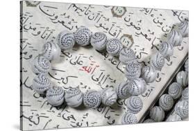 Quran and Tasbih (prayer beads), with Allah monogram in red, France-Godong-Stretched Canvas